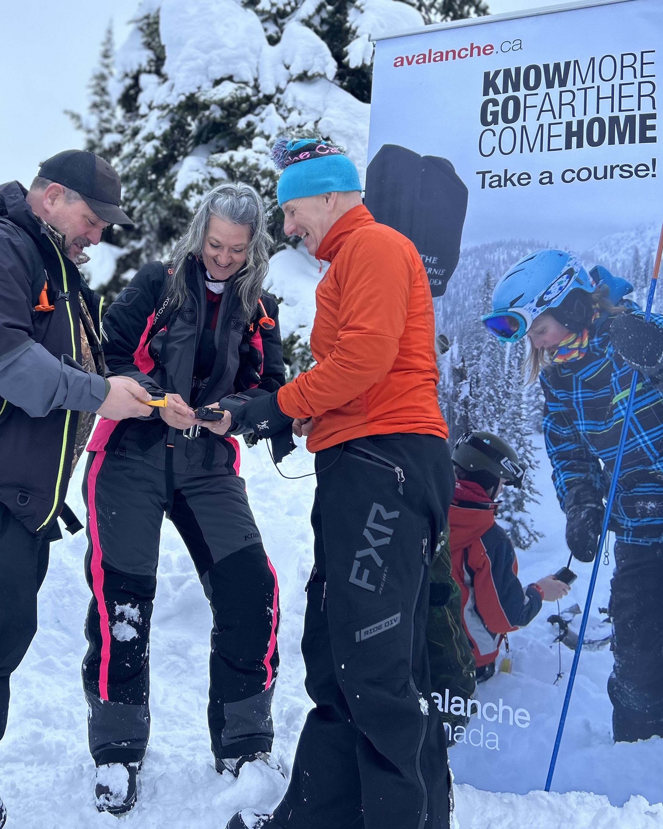 a field tech speaking with people at an event