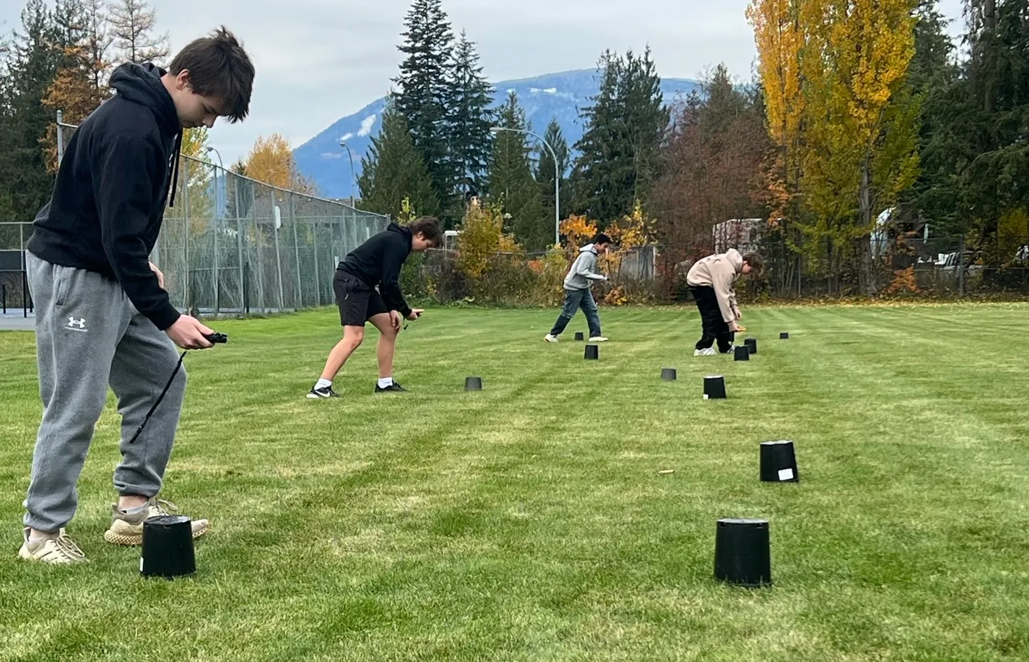 Students practise searching for transceivers buried under plant pots