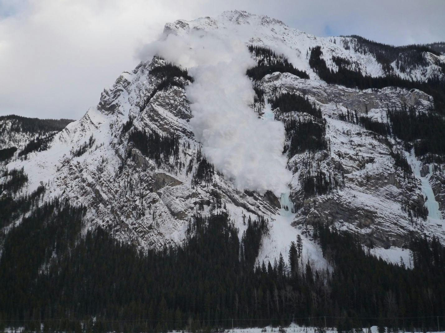 Image shows avalanche over Pilsner Pillar