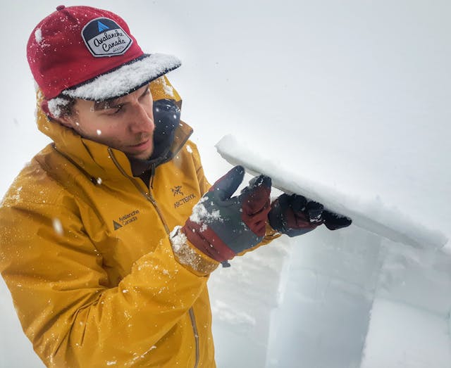 AvCan avalanche technician, Ben Hawkins, holds up a 3cm crust with facets.