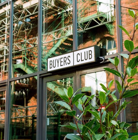 Buyers Club restaurant door and sign