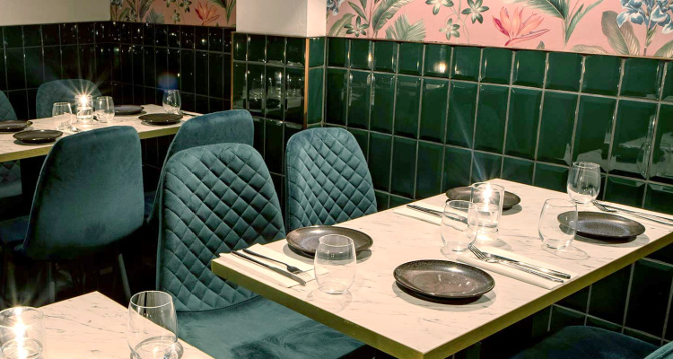 Table with plates, cutlery and water glasses at Wood & Water restaurant in Brixton, London