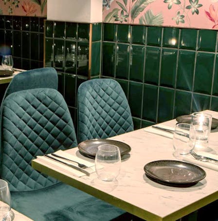 Table with plates, cutlery and water glasses at Wood & Water restaurant in Brixton, London