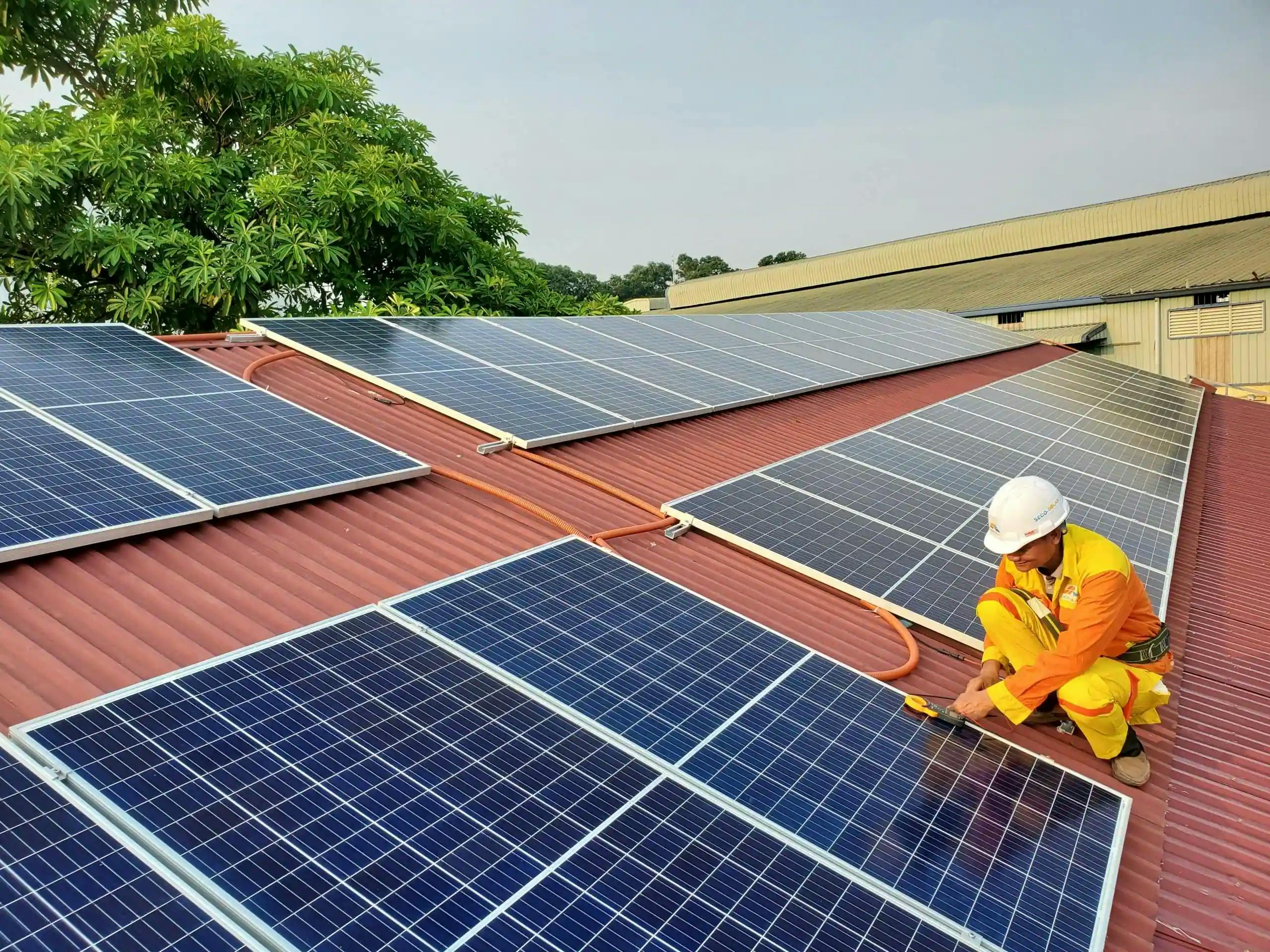 man installing solar panels