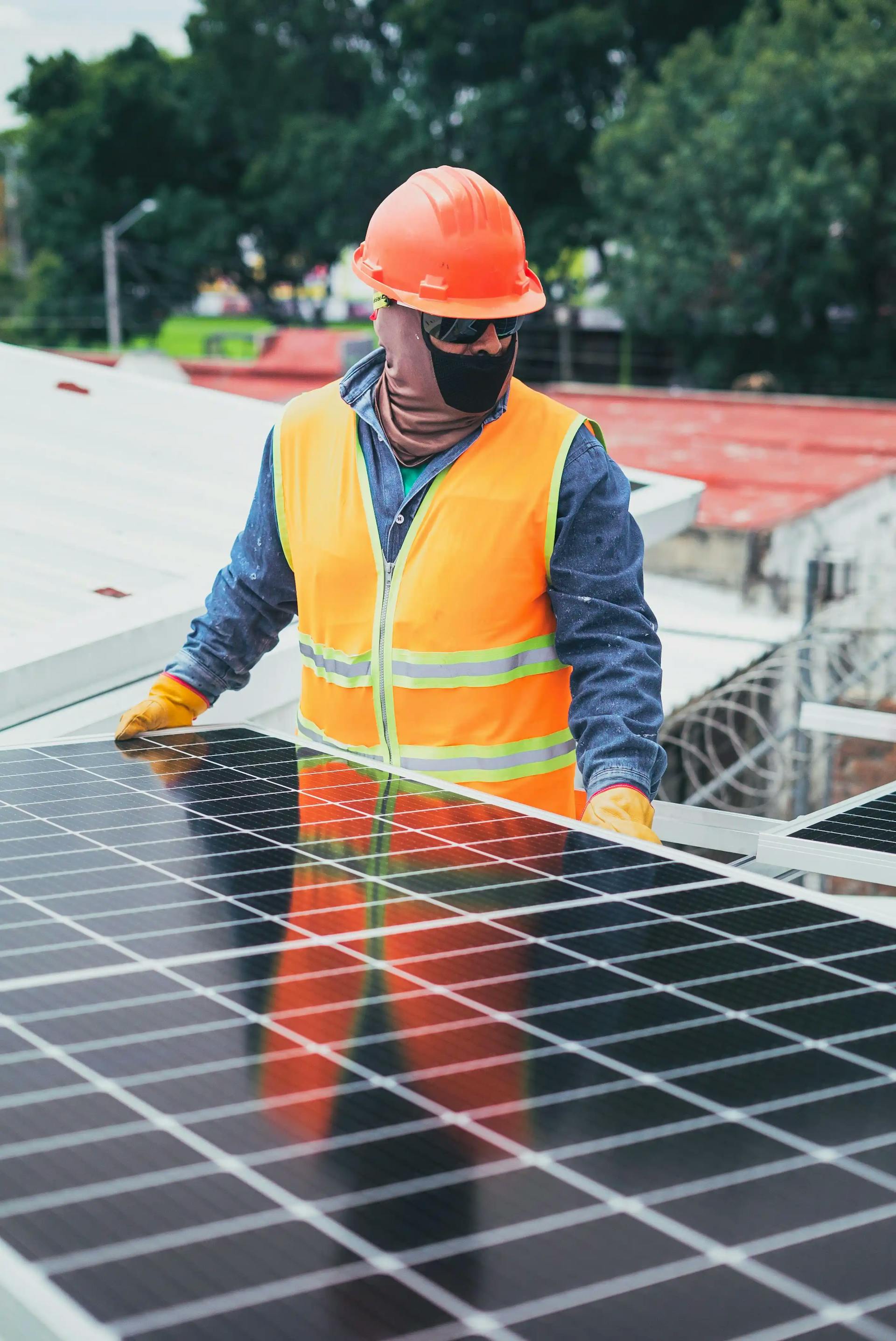 man carrying solar panel