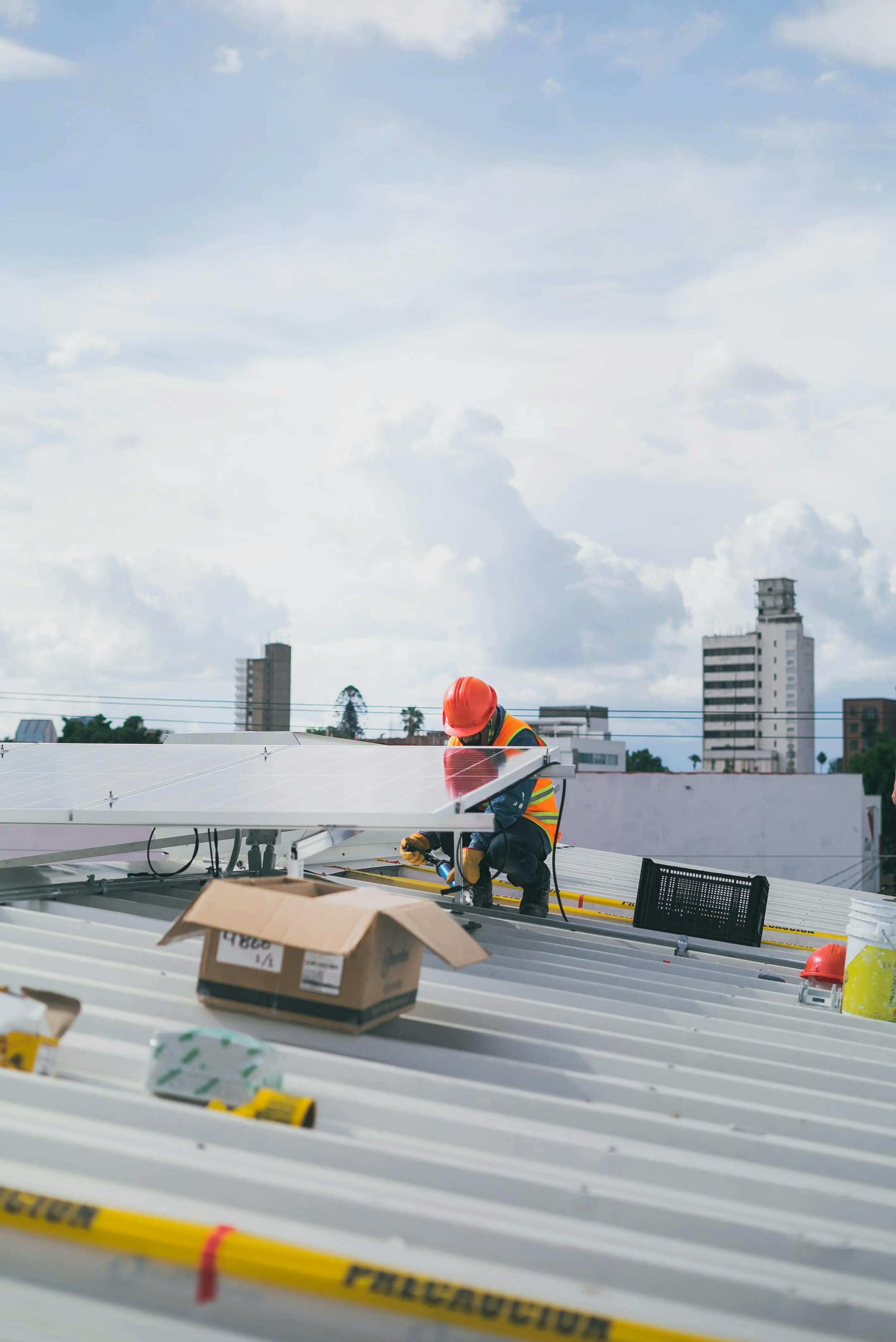 man installing solar panel