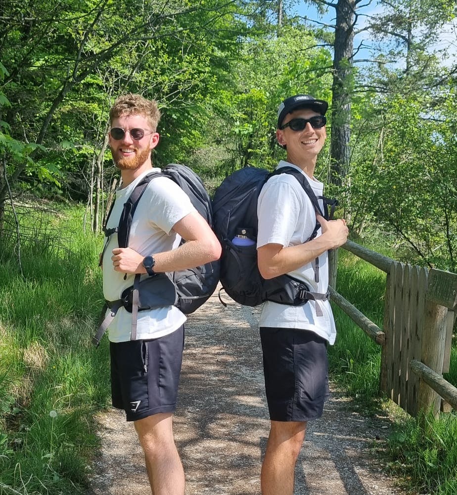 Josh and Fred near a sunny lake in Austria.