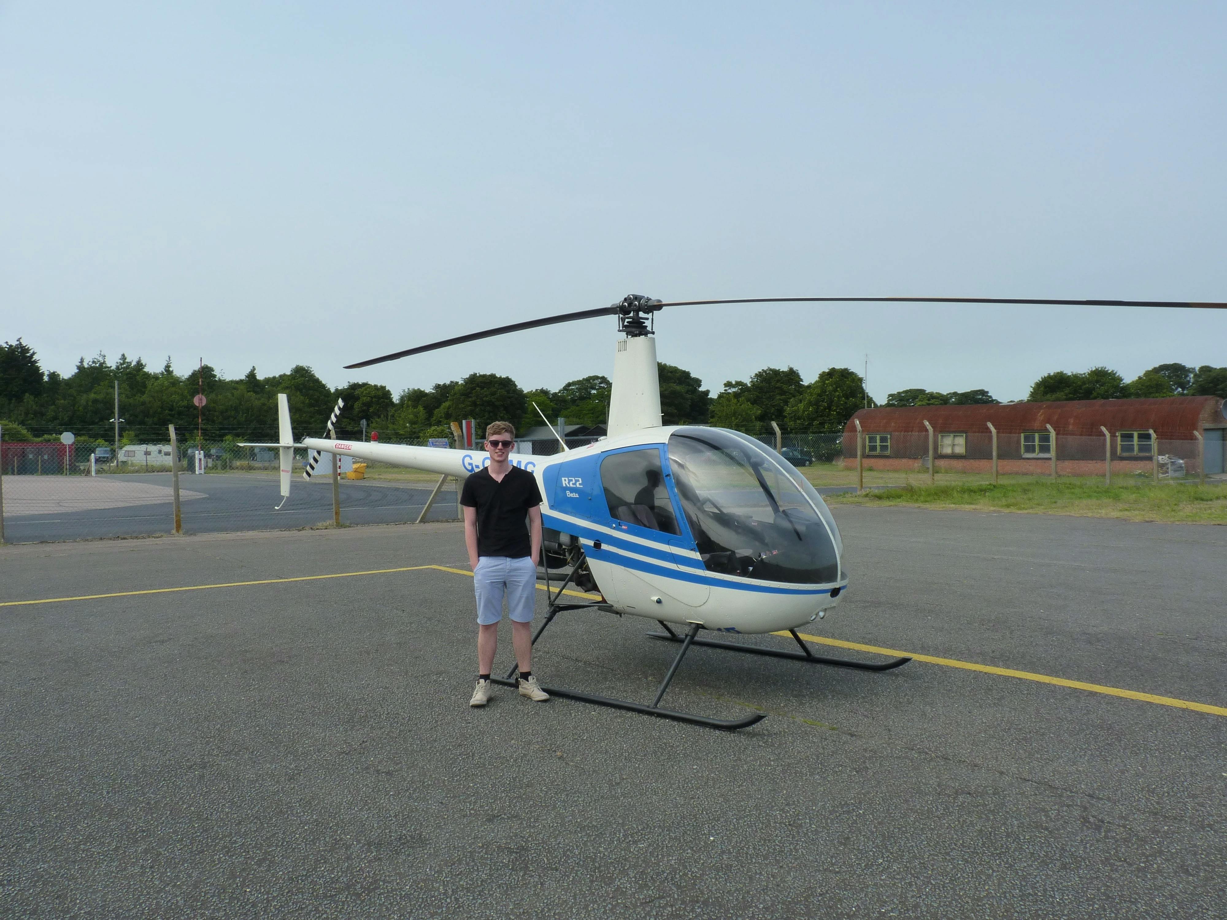 Fred with an R22 helicopter for his first trial flight in 2013