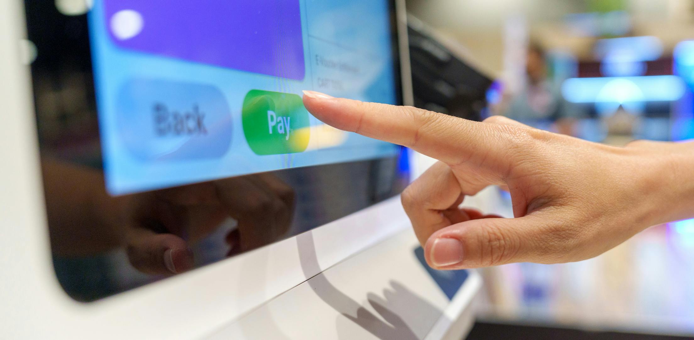 Hand pointing at screen