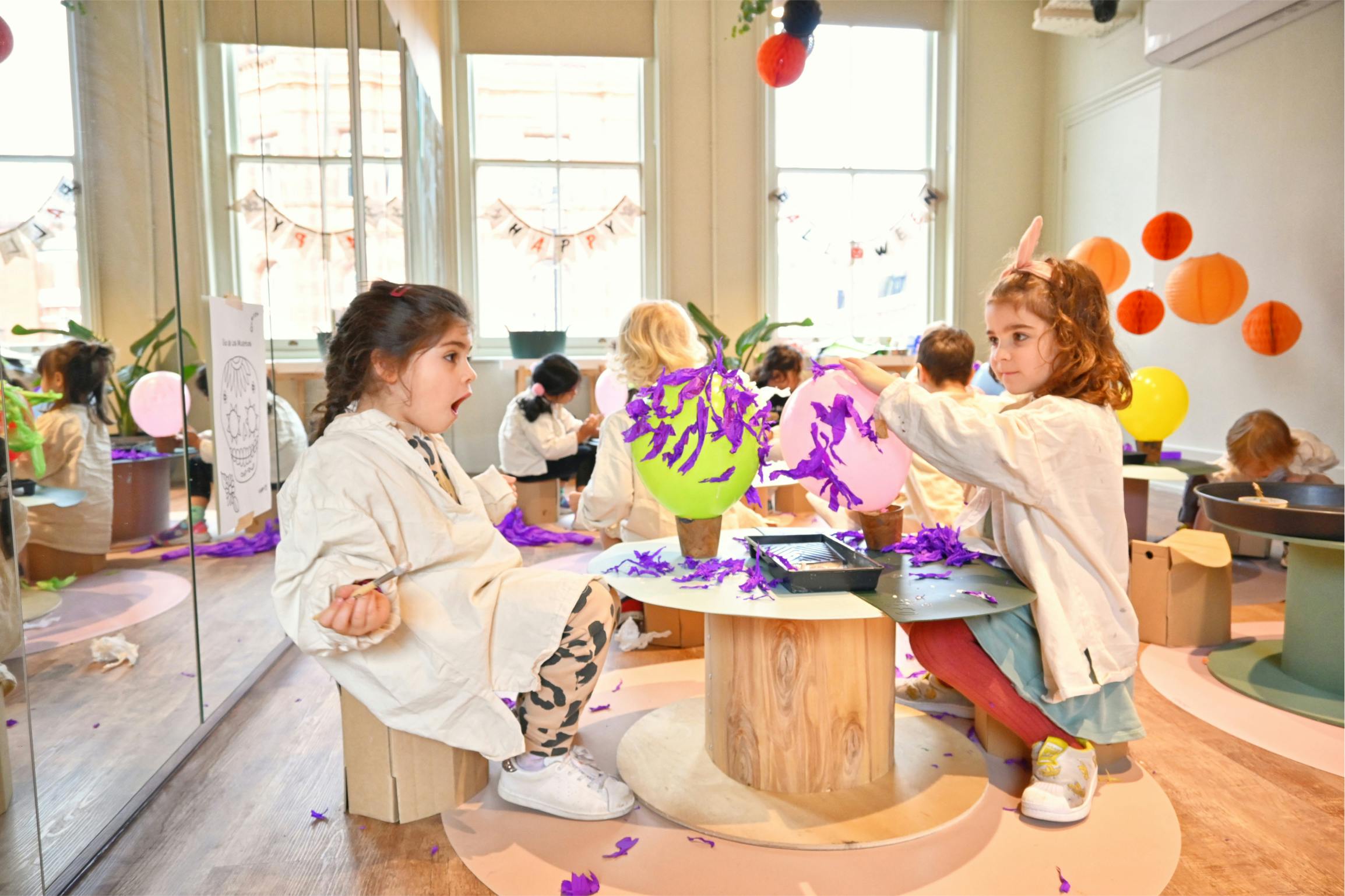 Little ones overjoyed creating paper mache