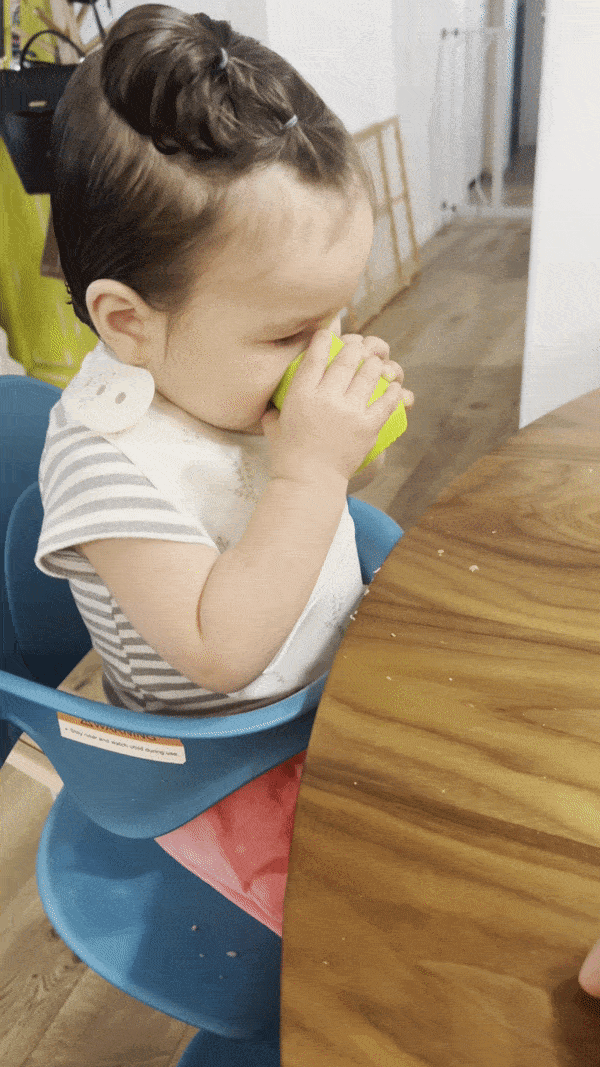 Learning how to drink out of an open cup