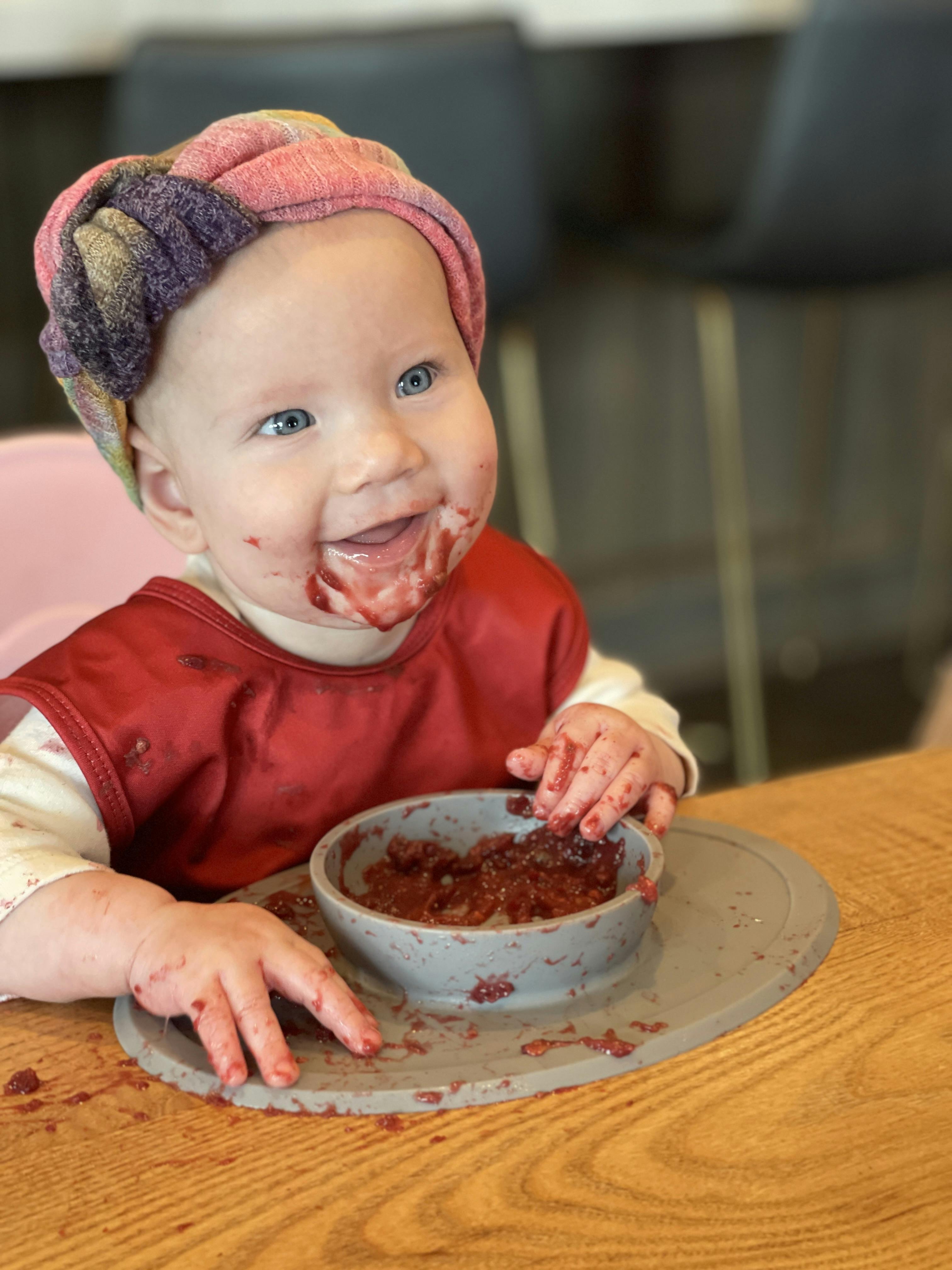 Baby-led weaning can be messy but it's part of the experience!