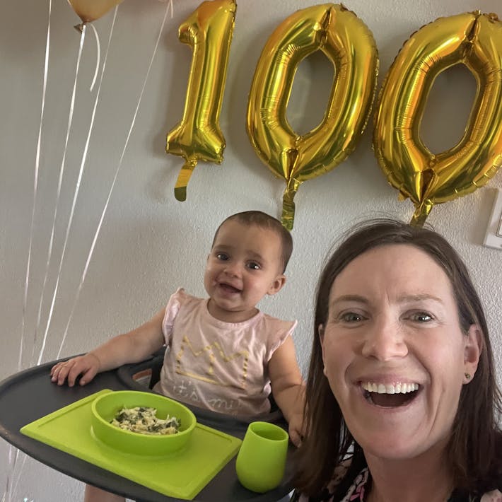 Dietitian Katie Ferraro celebrating Baby Emme's 100th food before her first birthday