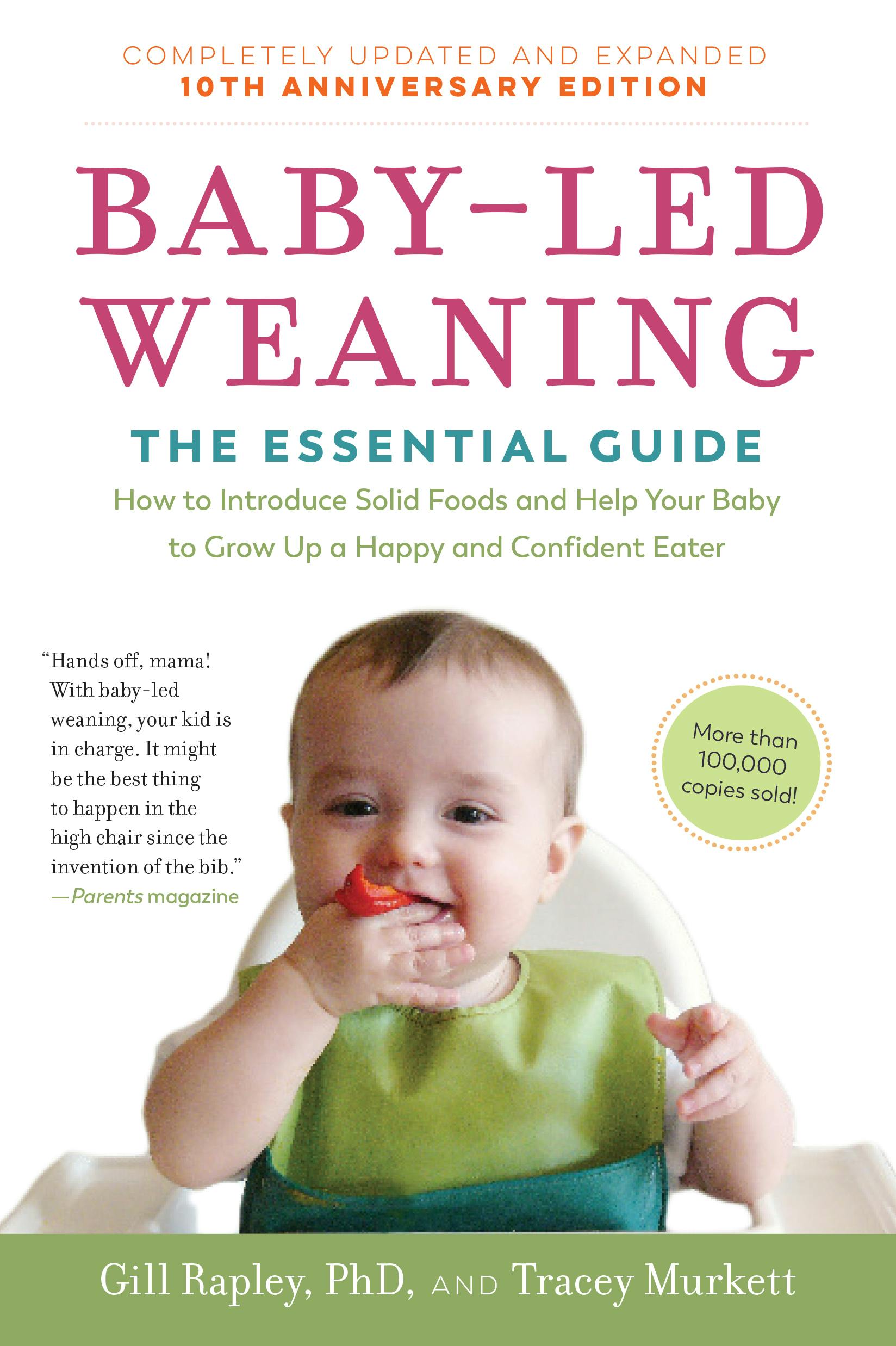 Photograph of the cover of the original baby-led weaning book co-authored by Gill Rapley. It is the revised 10th anniversary edition with photograph of baby on the cover bringing a strawberry to his mouth using his right hand.