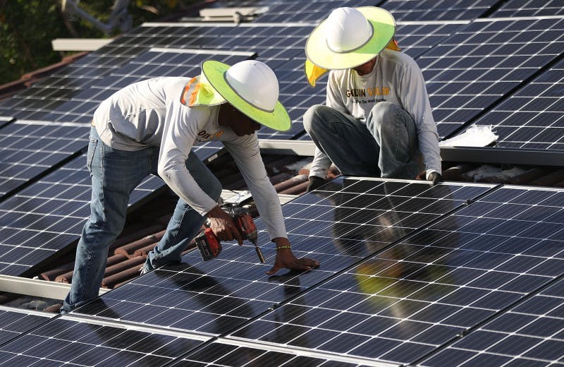 rooftop solar panel workers