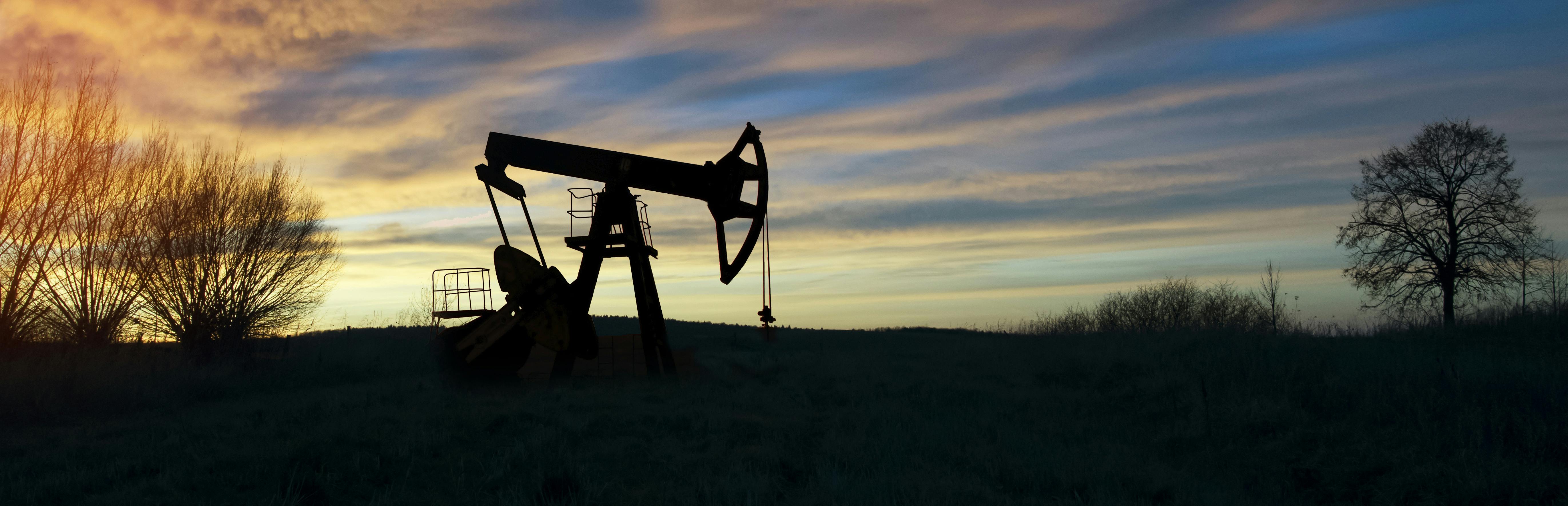 oil well drilling sunset fossil fuel