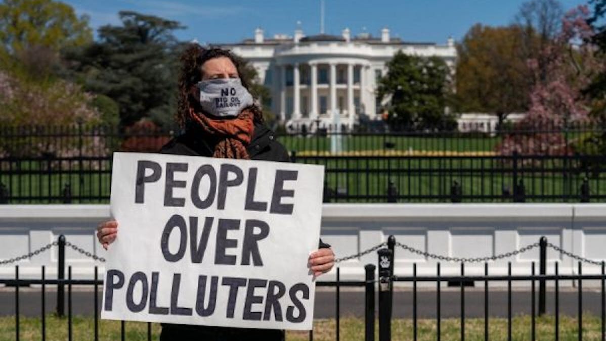 People over polluters protestor White House