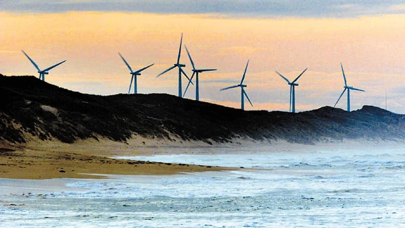 Wind turbines behind a beach