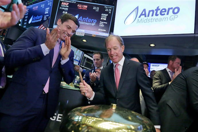 Antero Midstream CEO Paul Rady, right, alongside then-NYSE Group President Tom Farley, rings a ceremonial bell at the New York Stock Exchange after his company's initial public offering in May 2017.