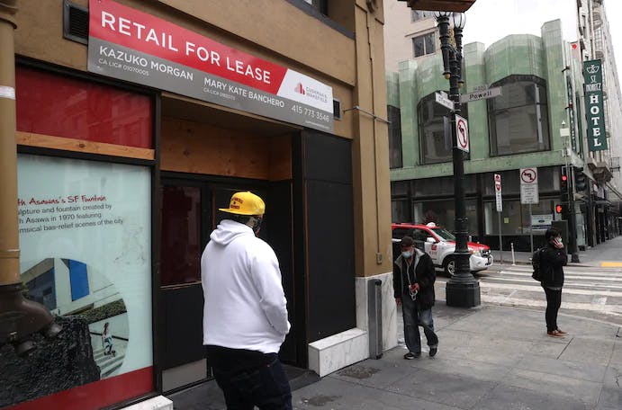 Pedestrians walk by retail spaces for lease last week in San Francisco. More than 2,000 businesses have closed in the Bay Area because of pandemic restrictions.