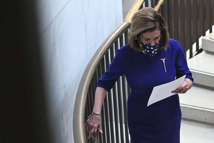 House Speaker Nancy Pelosi (D-Calif.) heads to a secure room at the Capitol on Monday.