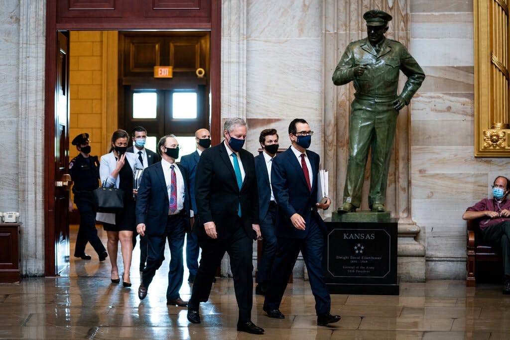 “If we can reach a compromise on these big issues, I think everything else will fall into place,” Treasury Secretary Steven Mnuchin, right, said after briefing Mr. McConnell on the latest meeting.