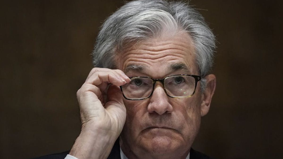 Federal Reserve Chair Jerome Powell adjusts his glasses