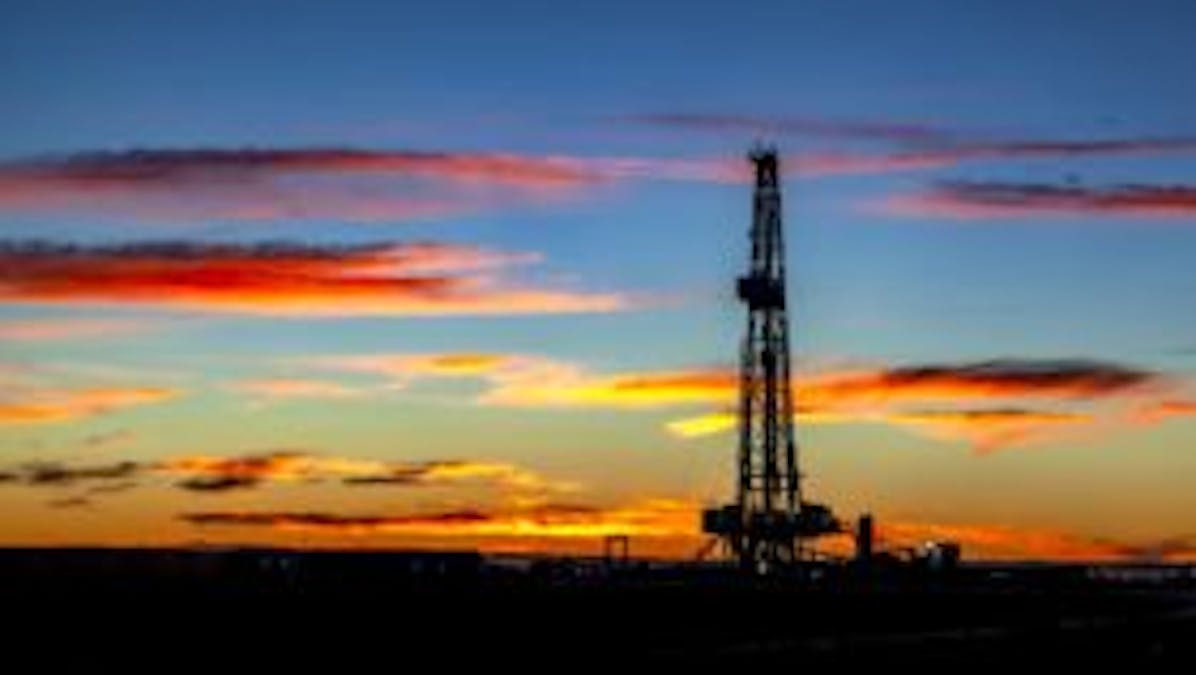 Oil well at sunset