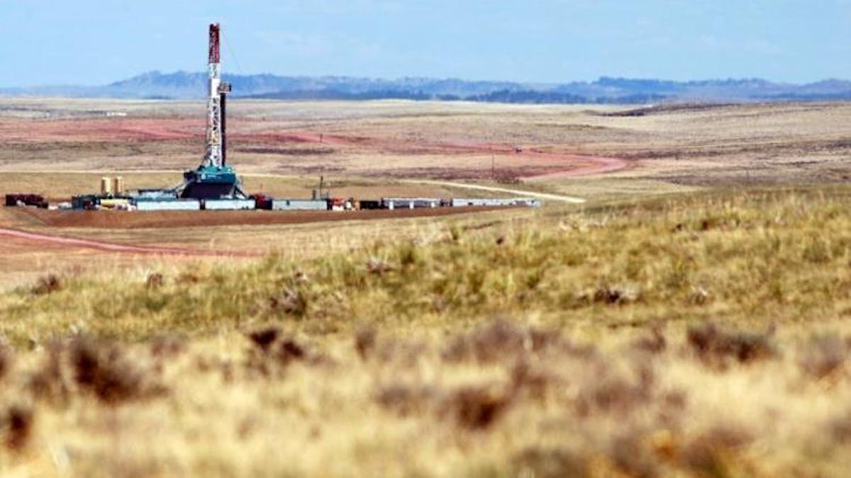 oil rig in field Wyoming