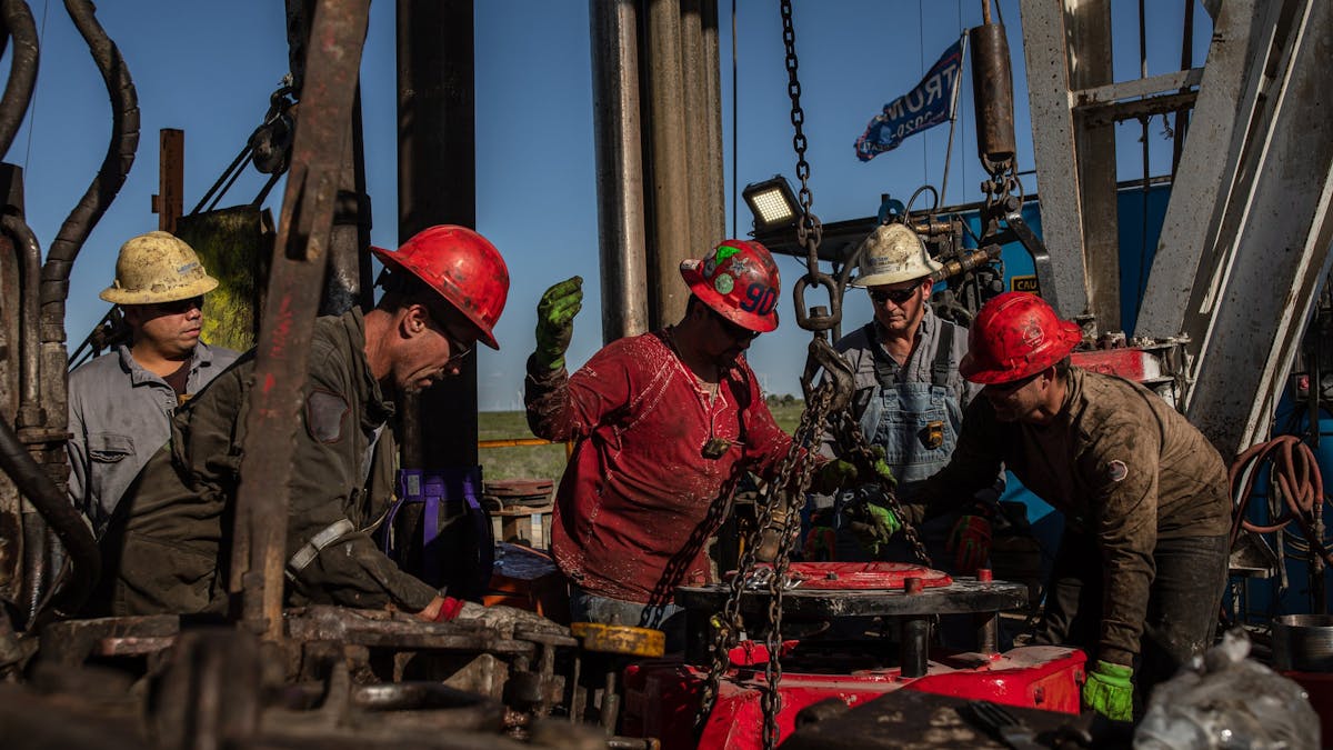 Oil workers at a drilling rig in Texas