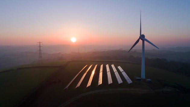 wind turbine solar panels sunrise