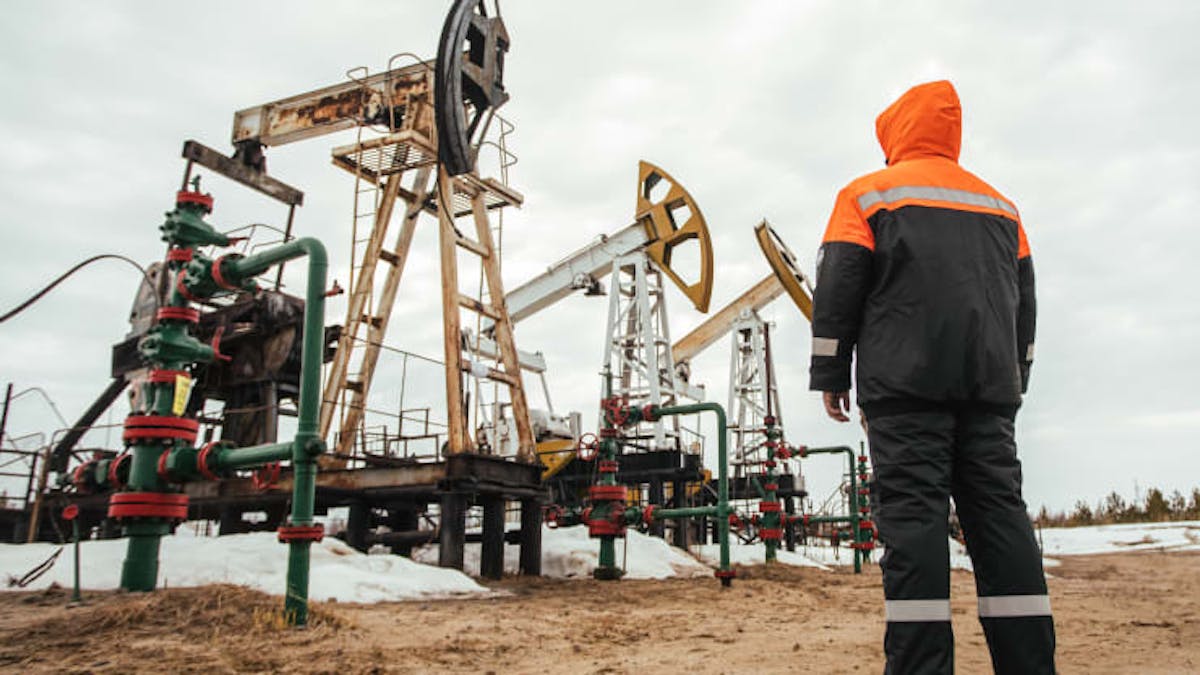 A Surgutneftegas worker near pumpjacks in Surgut Region of the Khanty-Mansi Autonomous Area - Yugra, in the West Siberian petroleum basin.
