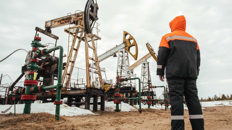 A Surgutneftegas worker near pumpjacks in Surgut Region of the Khanty-Mansi Autonomous Area - Yugra, in the West Siberian petroleum basin.
