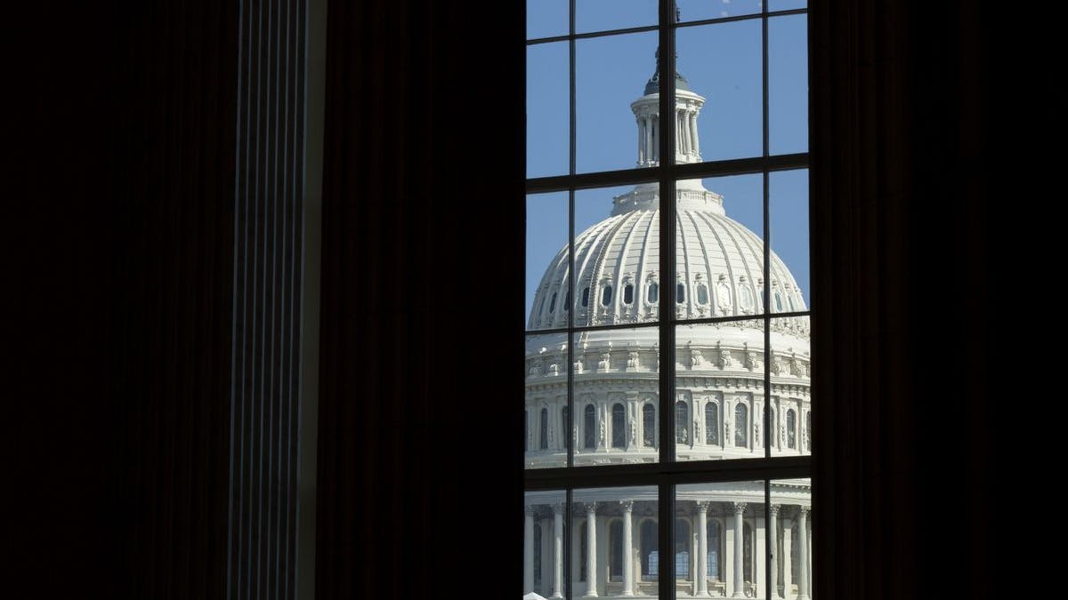 US Capitol through window