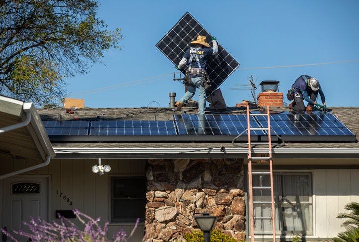 rooftop solar installation workers