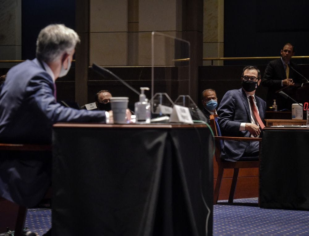 Jerome Powell, left, and Steven Mnuchin during the House Committee on Financial Services hearing on Oversight of the Treasury Department and Fed Reserve Pandemic response, on June 30.