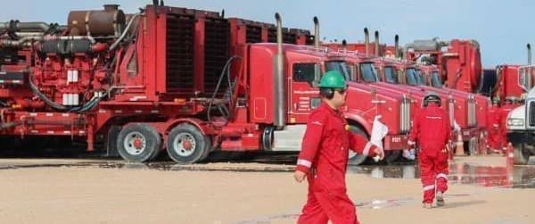 Red trucks workers fracking