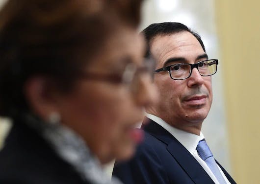 Jovita Carranza, administrator of the Small Business Administration, testifies as Treasury Secretary Steven Mnuchin looks on during a Senate hearing Wednesday.