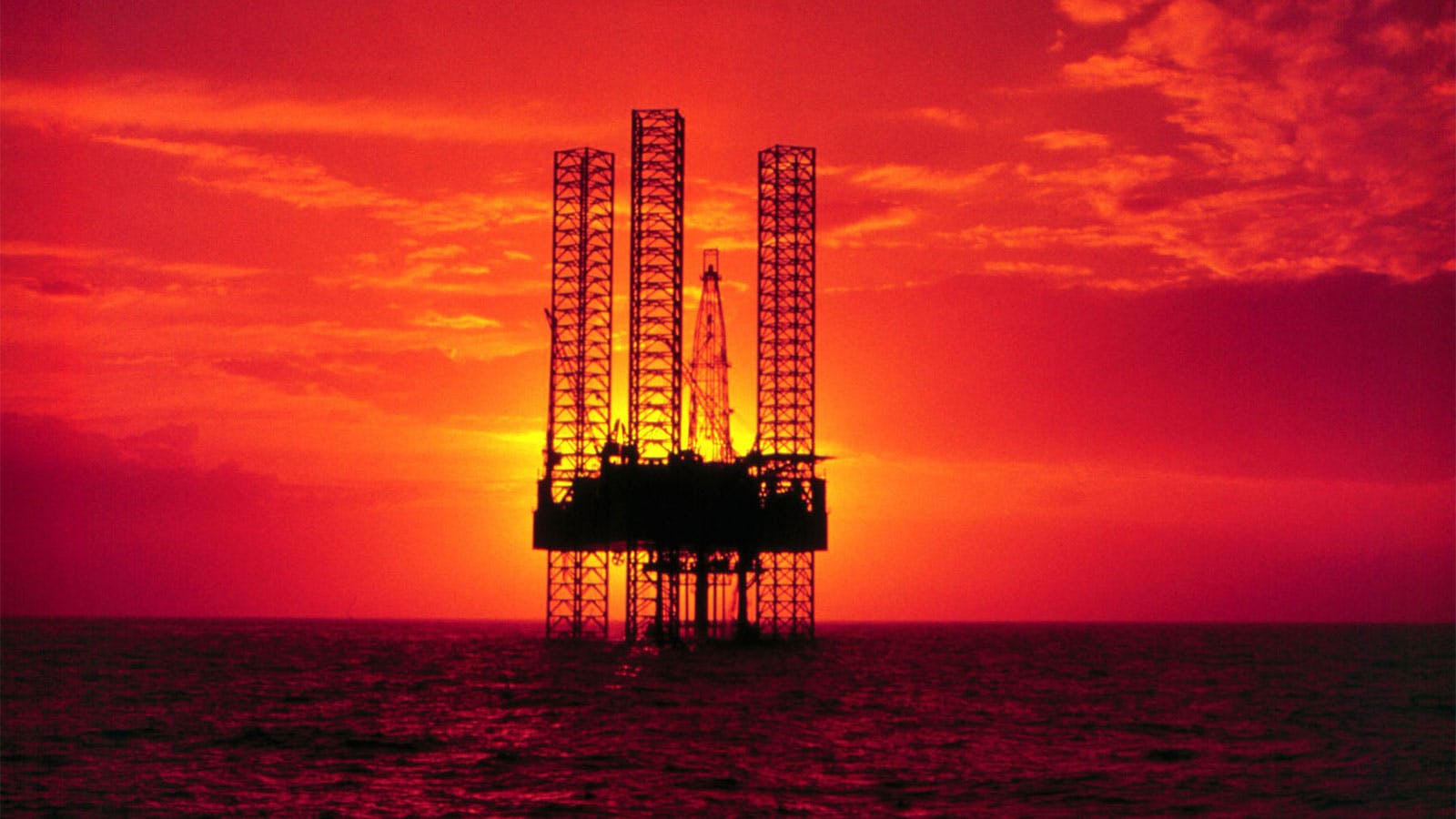 Offshore oil rig during sunset