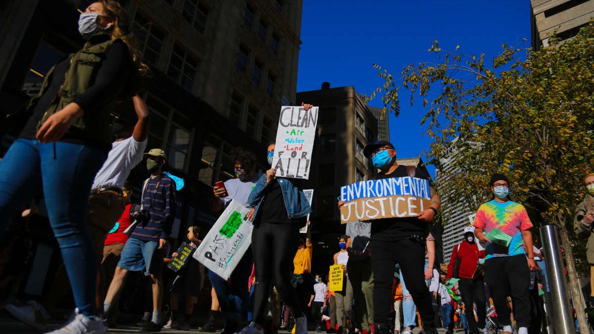 Protesters gather at Boston City Hall and march through downtown to demand immediate action for climate justice in Boston, Massachusetts, on October 15, 2020.