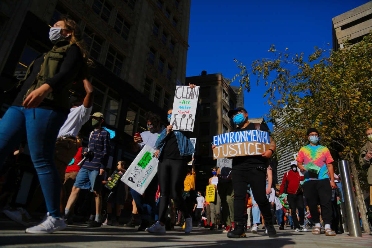 Protesters gather at Boston City Hall and march through downtown to demand immediate action for climate justice in Boston, Massachusetts, on October 15, 2020.