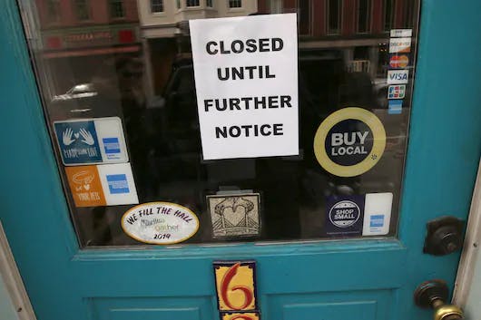 A "closed" sign hangs in the window of a shop in Portsmouth, N.H. on March 25 due to coronavirus concerns.