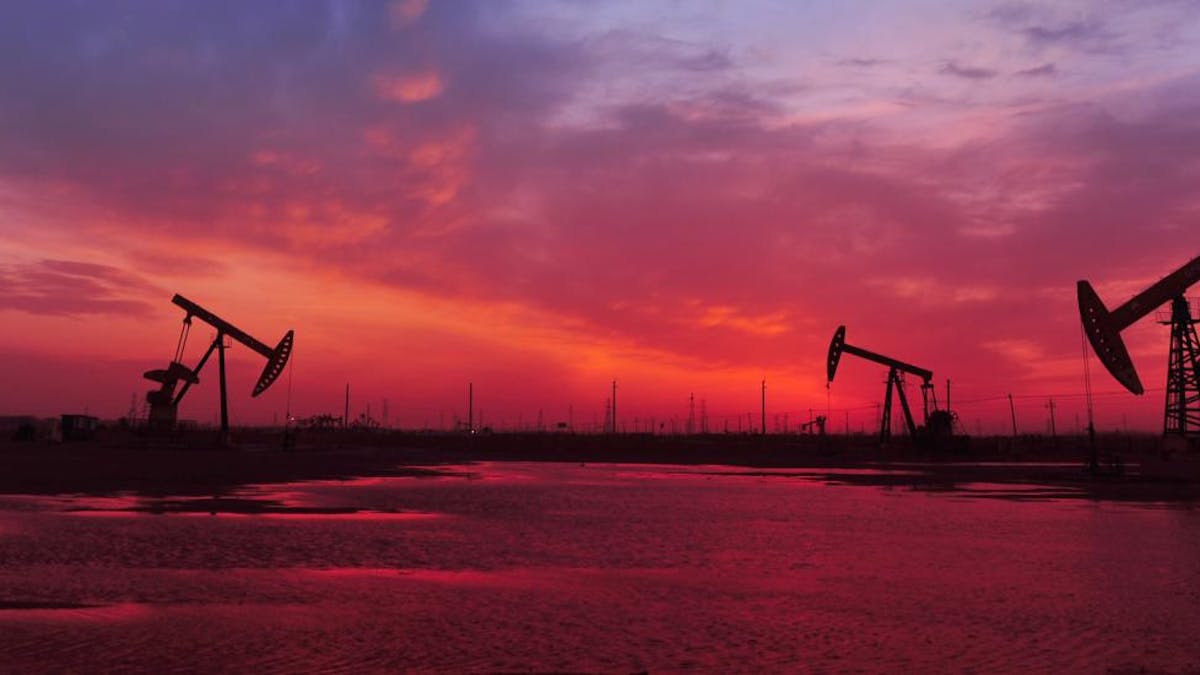Oil rigs at sunset