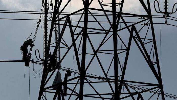 Electrical workers on power lines