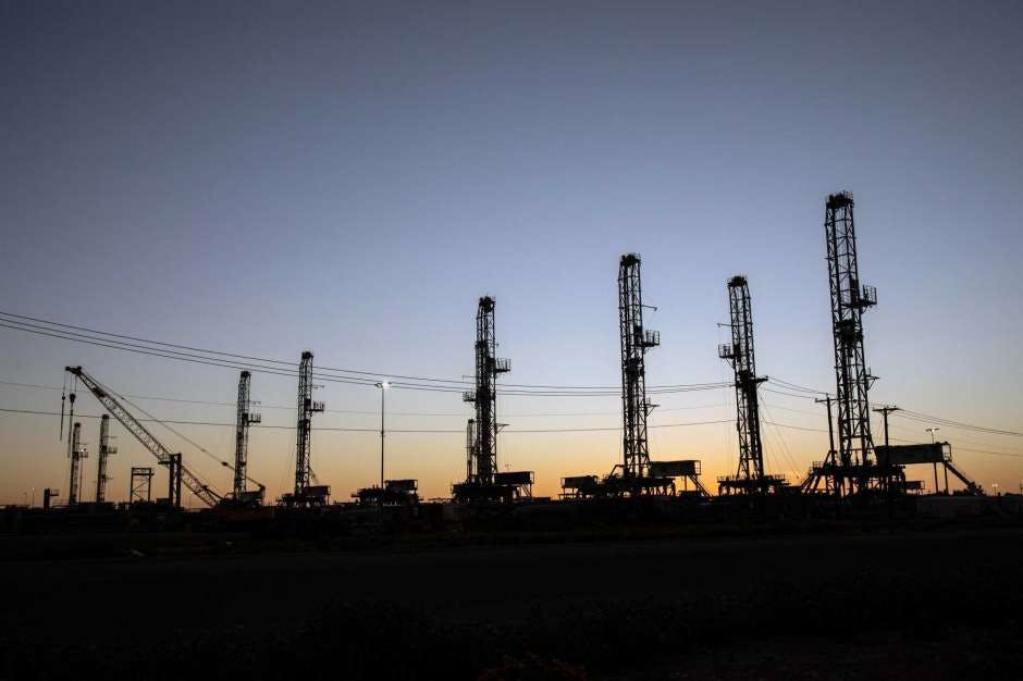 Unused oil drilling rigs are stored in Odessa, Texas, on April 24, 2020.The U.S. rig count remained unchanged from last week in a sign that perhaps the sharp plunge in drilling activity is finally bottoming out after 20 straight weeks of losses.  