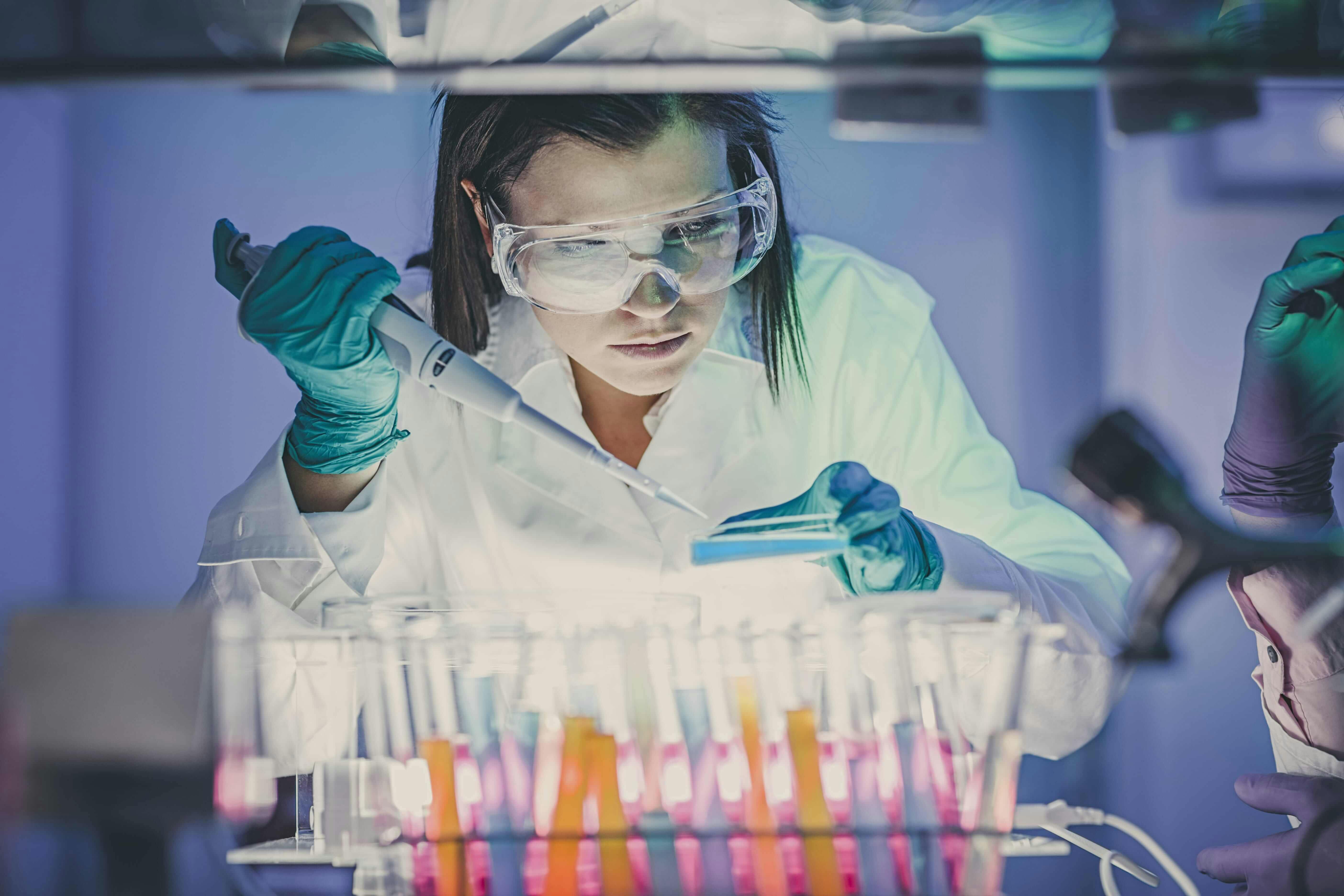 Scientist measures samples in a lab