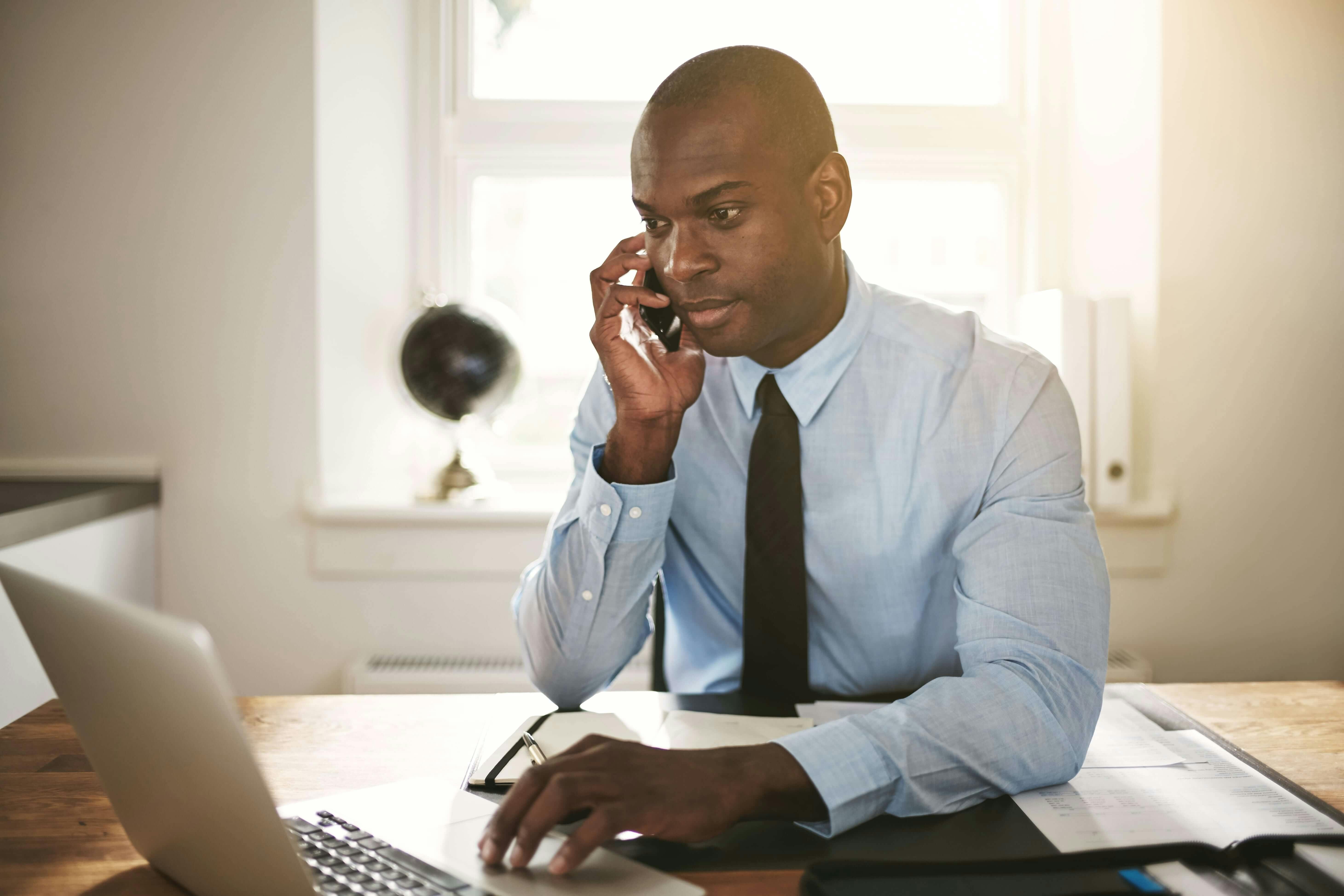 Lawyer on mobile phone in law firm office