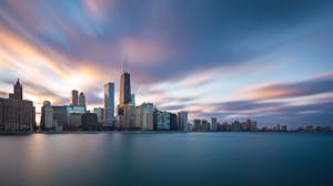 Chicago skyline with a lot of activity in the sky, sunset/sunrise, clouds