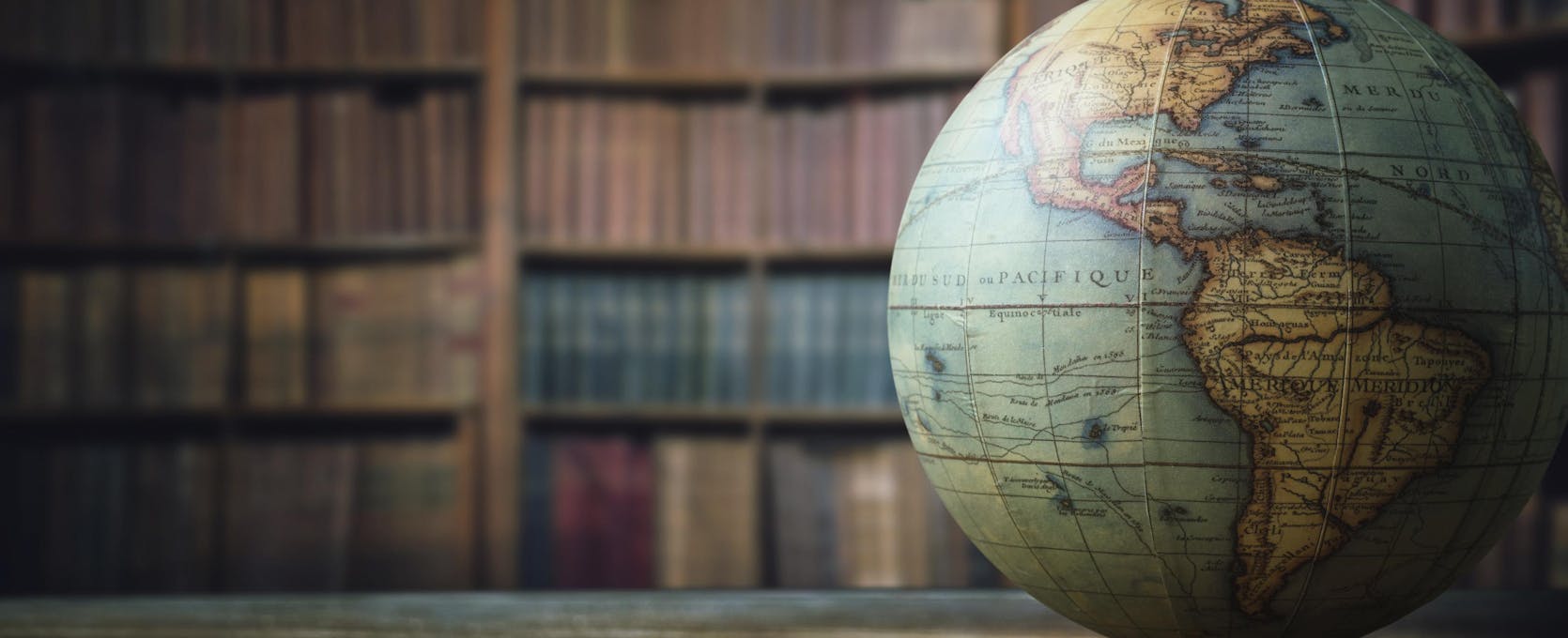A globe on the desk of an international business professional