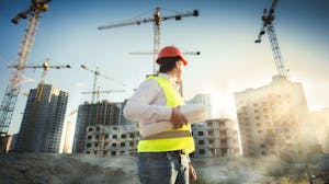 Construction industry professional overseeing a commercial construction project